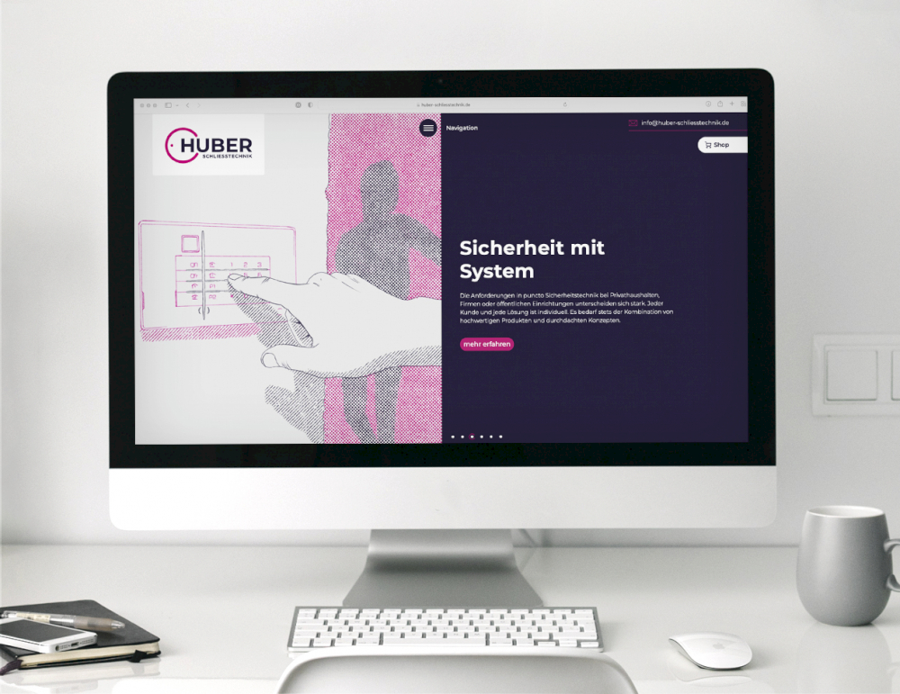 typneun Webdesign für Huber Schließtechnik: die neue Homepage auf einem Monitor